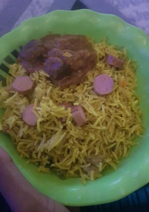 A picture of Basmati fried rice with sausages.