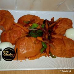 A picture of Moimoi with vegetable sauce.