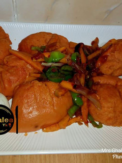 A picture of Moimoi with vegetable sauce.