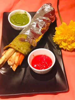 A picture of Spinach roll with paneer fillings.