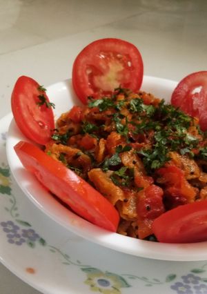 A picture of चपाती टमाटर में.