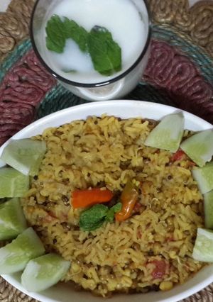 A picture of Mugachi Khichadi aani Masalyache Taak: Moong Daal/Sprouts Khichdi with spiced Buttermilk.