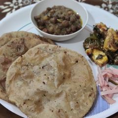 A picture of Jackfruit flour alu kachori with chane and paneer capsicum.