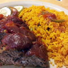 A picture of Yellow rice W/Red Beans & Surprise Meatloaf.