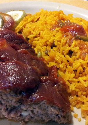 A picture of Yellow rice W/Red Beans & Surprise Meatloaf.