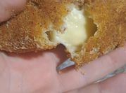 Una foto de dedos de queso rallado