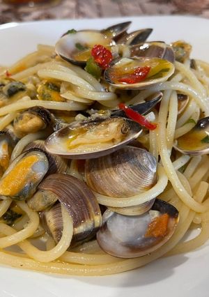 A picture of Spaghetti with Mussels, Clams, and Fresh Tomatoes.