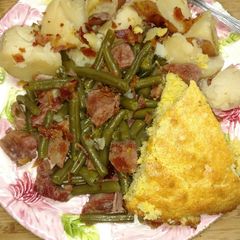 A picture of Ham and Beans with Potatoes and Cornbread.