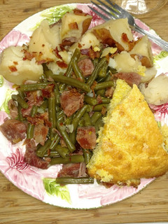 A picture of Ham and Beans with Potatoes and Cornbread.