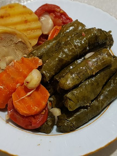 A picture of Stuffed grape/vine leaves (Yaprak) with artichoke.