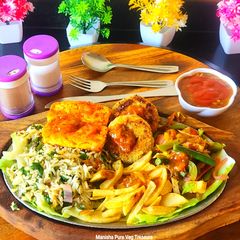 A picture of Exotic Veg Sizzler - Stir Fried Veggies Patty Garlicky Rice Grilled Paneer Steak Sizzler.