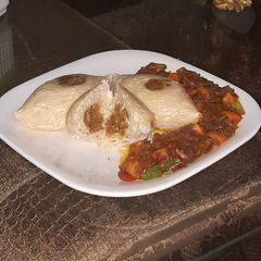 A picture of Stuffed spaghetti with saurce.