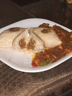 A picture of Stuffed spaghetti with saurce.