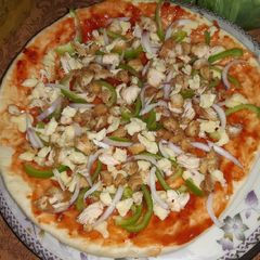 A picture of Chicken Cheese Tikka Pizza.