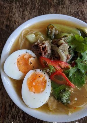 A picture of Beef bone broth with noodles.