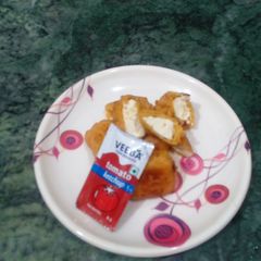 A picture of Cottage cheese fritters in chana dal paste..