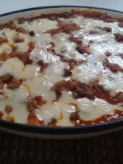 Una foto de Lasagna. Relleno: jamón y queso + salsa bechamel