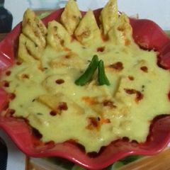 A picture of Besan jimiknd (Pittora) with Gravy.