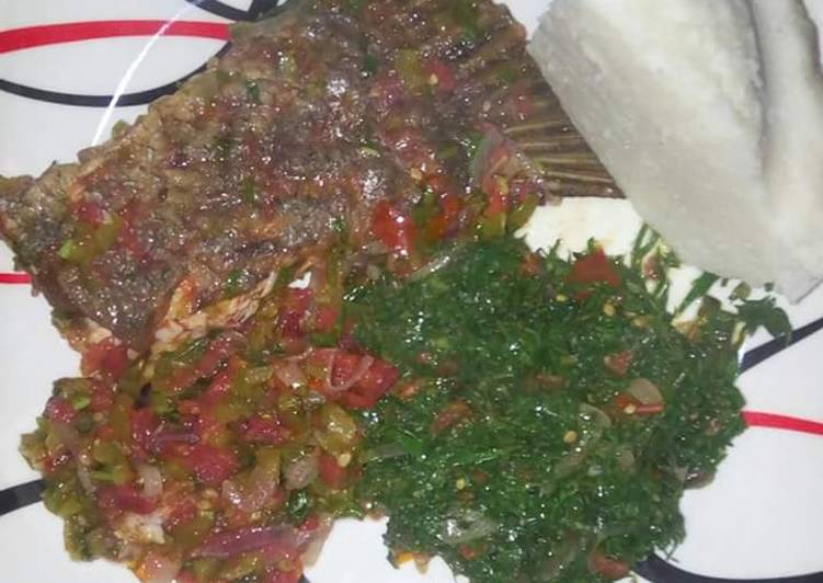 Wet fried fish, kales with Ugali