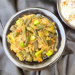 A picture of Fried Bhindi Pyaz 🍅🌶️🧅.
