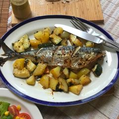 A picture of Roasted Mackerel with veggies.
