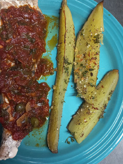 A picture of Yellowtail with Mediterranean Sauce.