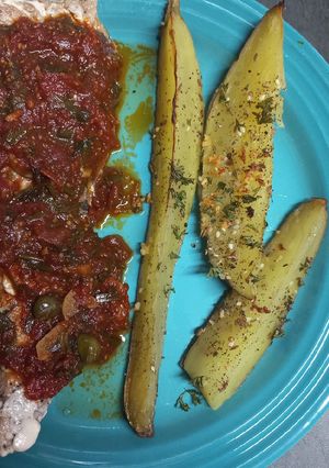 A picture of Yellowtail with Mediterranean Sauce.