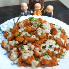 A picture of Chicken Poppers with Cheesy Sauce.