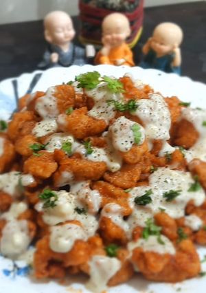 A picture of Chicken Poppers with Cheesy Sauce.