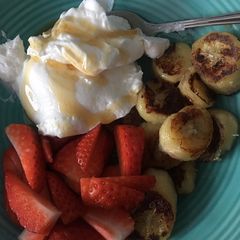 A picture of Caramelised Banana with fat free coconut yogurt and berries.