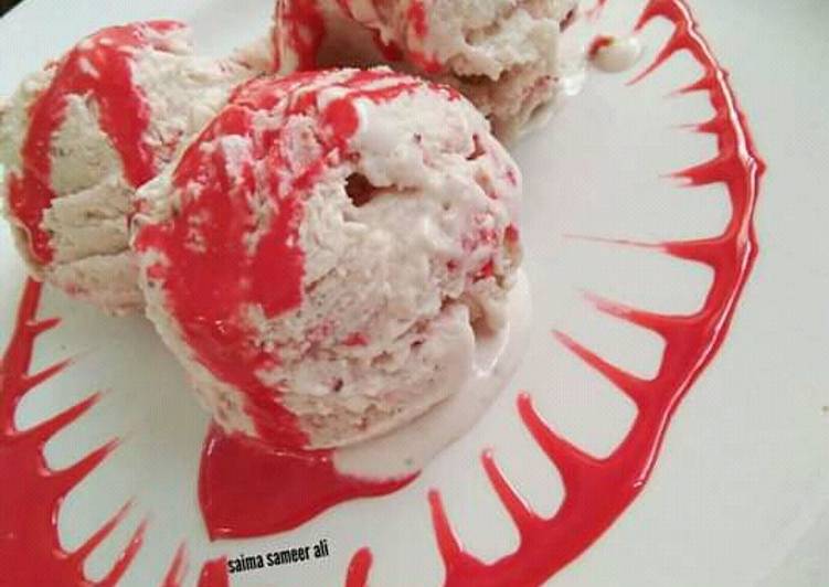 Homemade strawberry ice cream with homemade strawberry sauce