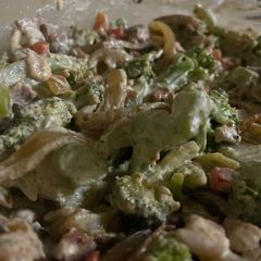 A picture of Broccoli with sour cream, onions, bacon and mushrooms.