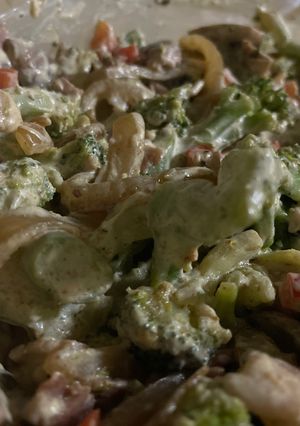 A picture of Broccoli with sour cream, onions, bacon and mushrooms.