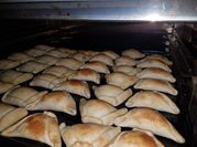 Una foto de empanada bechamel