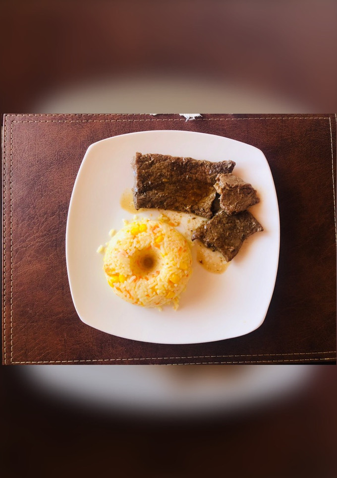 Una foto de Arrozin con bistec 🥩