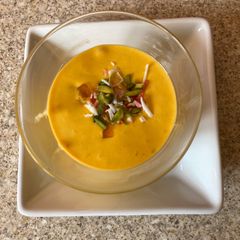 A picture of Fruit salad with mango pulp.