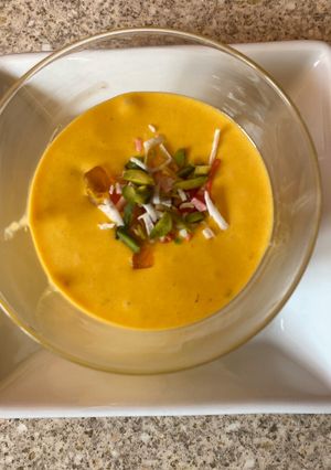 A picture of Fruit salad with mango pulp.