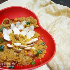 A picture of Suji Halwa with Poori.