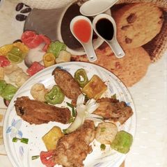 A picture of Chicken wings with chicken soup.