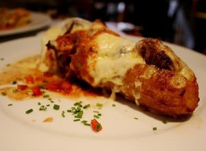 Una foto de Plátanos maduros con queso