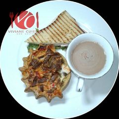 A picture of Gizzad sandwich with choco drink.