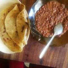 A picture of Chapati served with coconut beans# authormarathon#.
