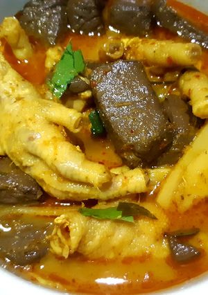 A picture of Spicy Red Curry Chicken Feet with Pickled Bamboo Shoots.