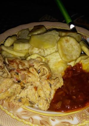 A picture of Fried sweet potato with stew and Scrabble egg.