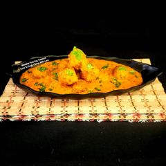 A picture of Raw Banana Sweet Potato Kofta Curry.