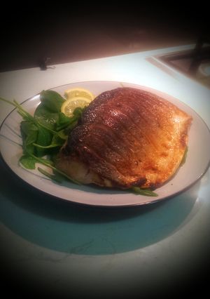 A picture of Crispy Skin Salmon with Spinach Salad.