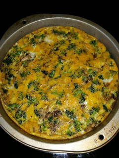 A picture of Broccolli, spinach, and mushroom quiche.