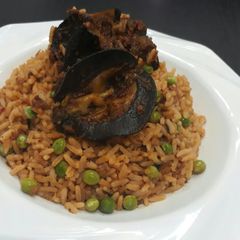 Jollof rice with snail A picture of Jollof rice with snail.
