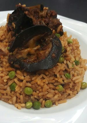 A picture of Jollof rice with snail.