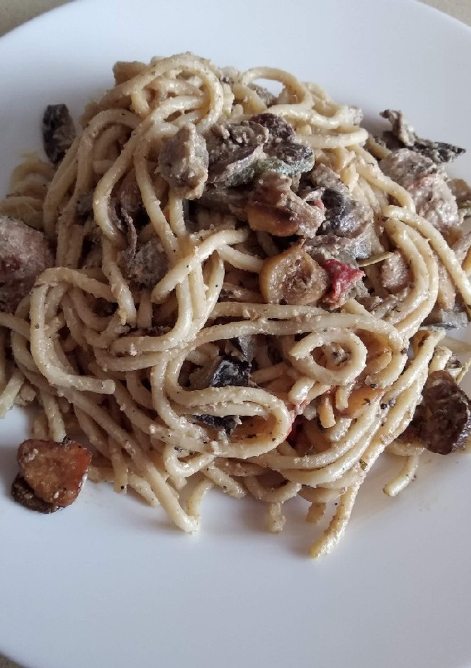 Una foto de Spaghettis con champiñones a la naranja